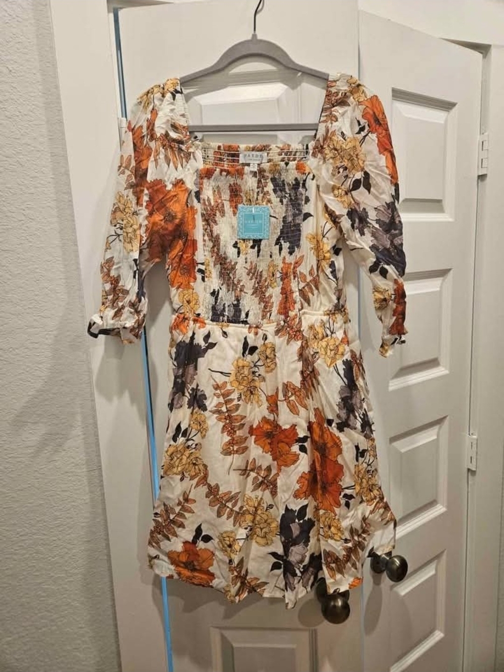 Hayden Floral Smocked Mini Dress in Cream, Rust, and Yellow